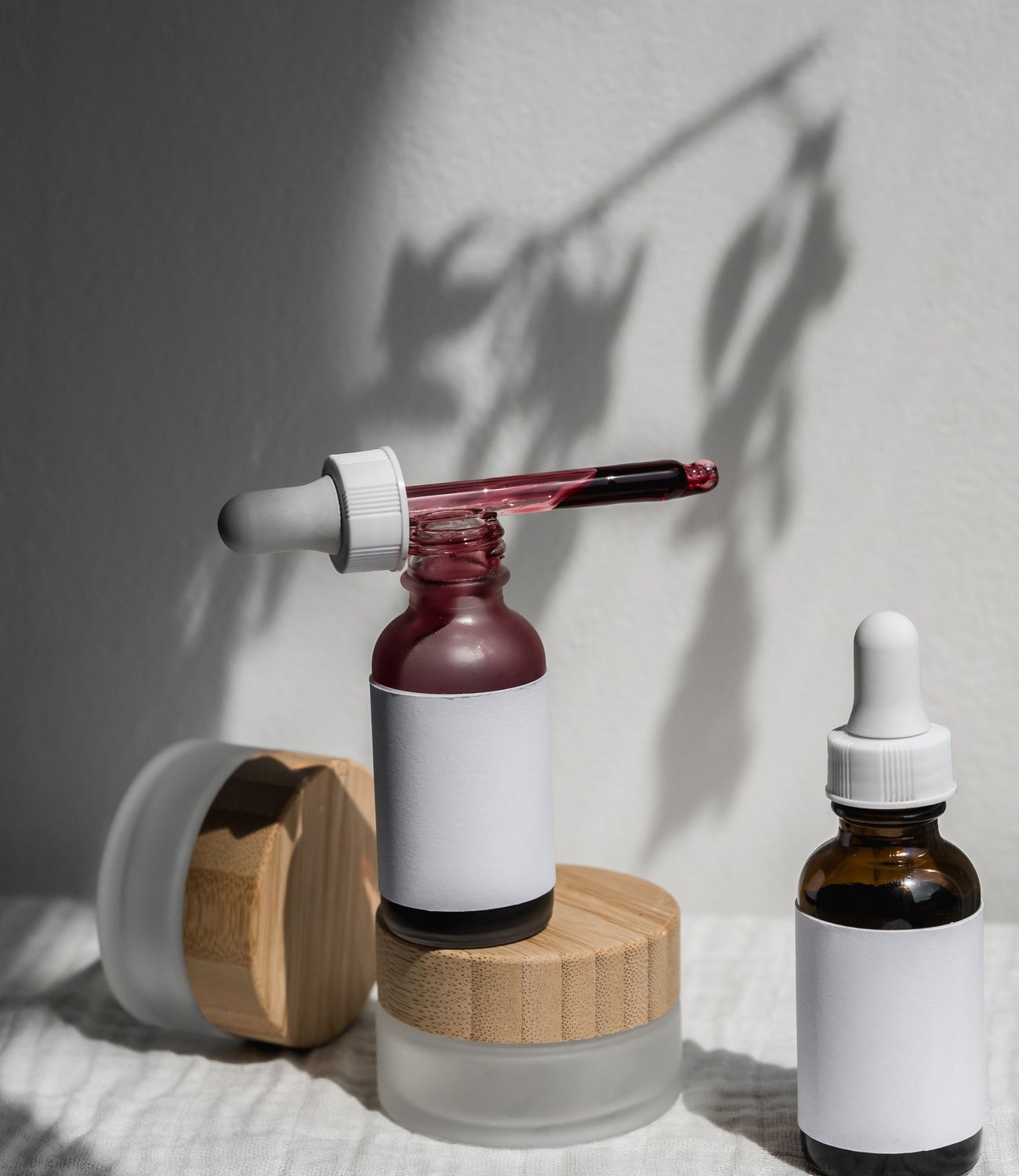 LUMANCE serum bottles with soft morning shadows
